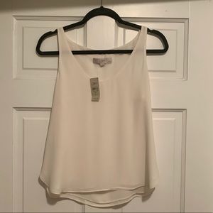 Cream colored Loft blouse. Size small petite. Never worn. Great condition.